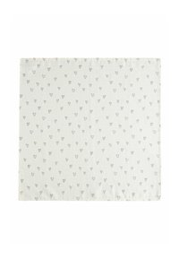 Table placemat made of white fabric, featuring a repeating pattern of small black hearts. Rectangular shape with a textured surface.