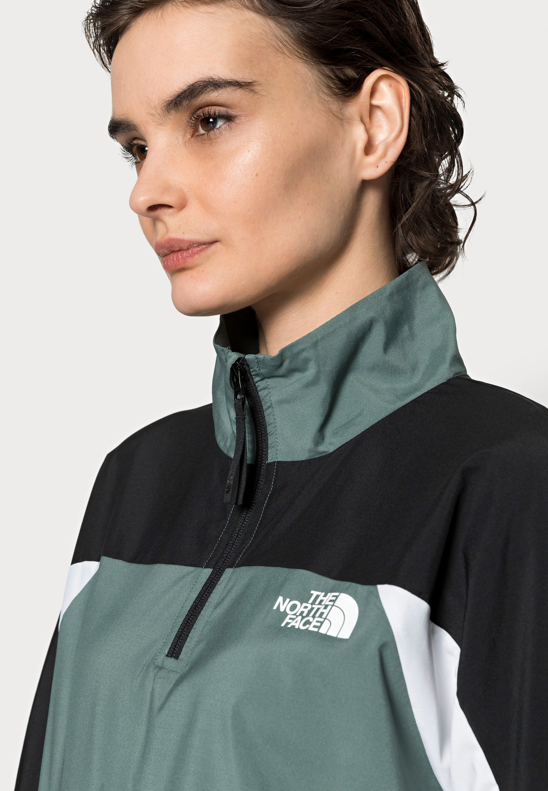 green windbreaker jacket