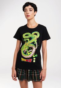 Black cotton t-shirt featuring a vibrant green dragon graphic with a yellow crown and "Dragon Ball Z" text in red and blue.
