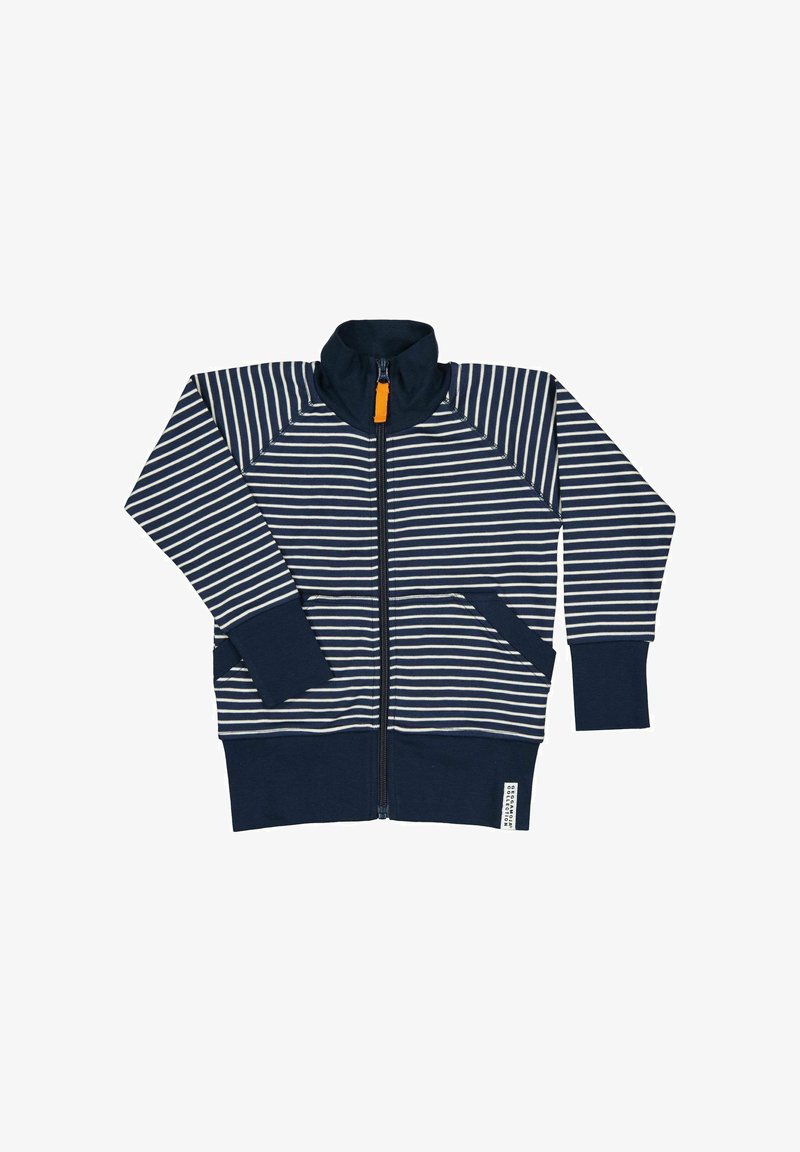 Navy ja valge triibuline tõmblukuga jakk, millel on kõrge kaelus, pikad varrukad ja kaks esist pocketit. Oranž tõmbluku kinnitus. Pehme kangast tekstuur.