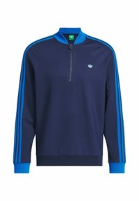 Sweatshirt azul-marinho com fecho de correr no pescoço, feito de tecido macio, com três riscas azuis ao longo das mangas e um pequeno logótipo no peito.
