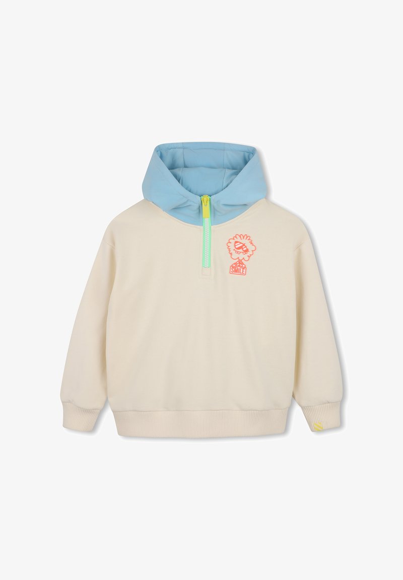 Pull crème avec capuche bleu clair, fermeture éclair vert néon et petit motif de fleur orange avec le mot "SMILE" sur la poitrine.