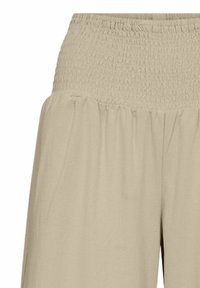 Pantaloni a gamba larga di un beige chiaro, caratterizzati da un design con vita arricciata, tessuto leggero e una texture plissettata, adatti per un look casual.