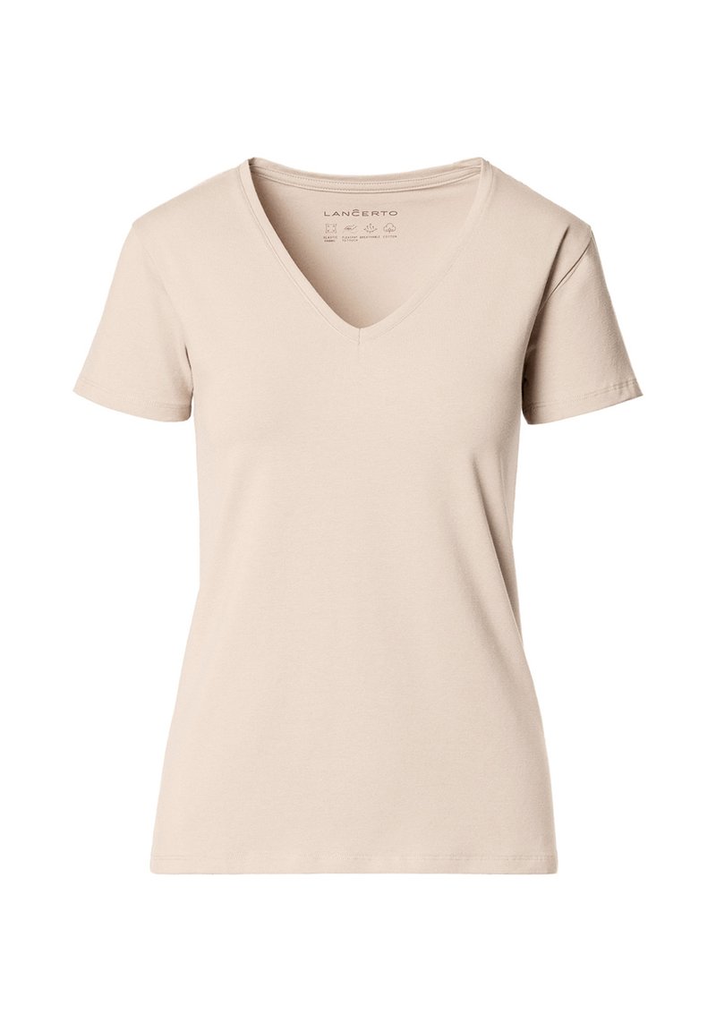 Beżowa damska koszulka z krótkim rękawem i dekoltem w serek, o prostym, dopasowanym kroju i gładkiej fakturze materiału na białym tle.