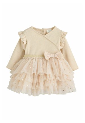 Beigefarbenes Baby-Outfit mit langen Ärmeln, gerafften Schultern, gestuftem Tüllrock mit goldenen Sternen und einer Stoffschleife an der Taille.