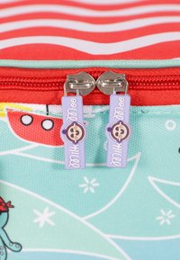 Zippered bag with red and white striped top, mint green base, and playful patterns. Features purple zipper pulls with cute monkey design.
