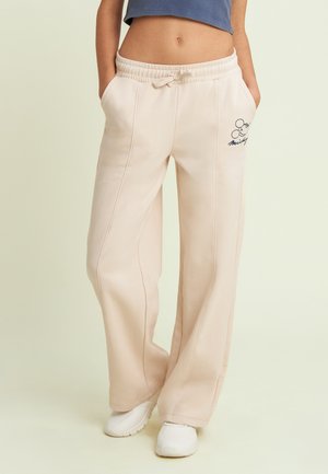 CON RICAMO MICKEY - Pantalon de survêtement - beige