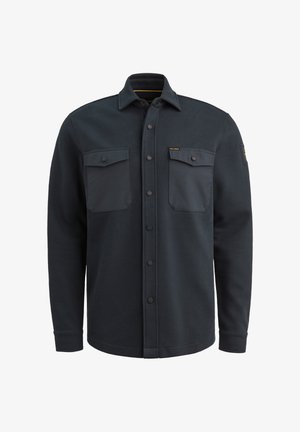 Dunkelgraues Hemd mit Knopfverschluss und zwei vorderen Taschen, aus strukturiertem Stoff. Mit Kragen und schwarzen Knopfverschluss ausgestattet.
