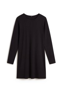Tunique noire à manches longues en tissu léger, avec un col rond et des fentes latérales discrètes pour faciliter le mouvement.