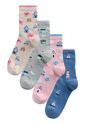 Four colorful socks with seaside designs including crabs, beach chairs, houses, shells, sailboats, and a lighthouse.