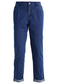 Džínové kalhoty v tmavě modré barvě. Mají rovný střih, manžety na koncích nohavic a jedno zapínání na knoflík. Materiál vypadá měkce s jemnou strukturou.