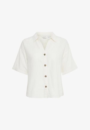 Krátky rukáv, biely golierový top vyrobený z ľanu. Má šesť dekoračných gombíkov s nádychom korytnačiny na prednej strane.