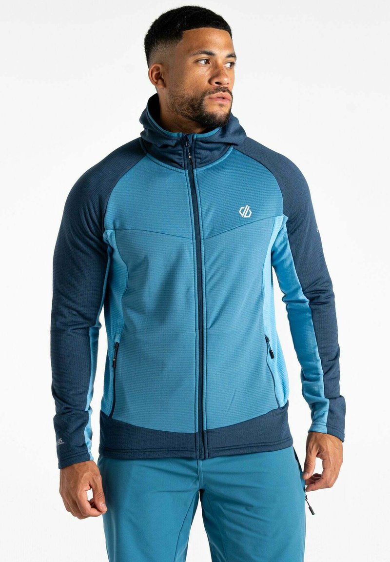 Blaues Zip-Hoodie aus einer Mischung aus strukturierten und glatten Stoffen. Verfügt über Seitentaschen, einen hohen Kragen und kontrastierende marineblaue Ärmel.