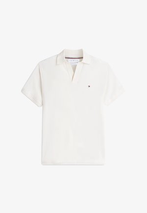 Witte polo met korte mouwen, geribbelde kraag, knoopsluiting en klein Tommy Hilfiger-logo op de linkerborst.