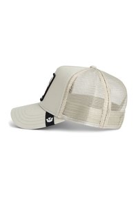Beige baseball cap with a solid front panel and mesh back. Features a curved brim and a black logo label on the side.