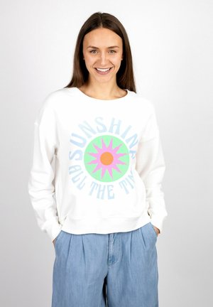 White sweatshirt featuring a colorful sun graphic with a pink outline and green background. Designed with a round neckline and loose fit.