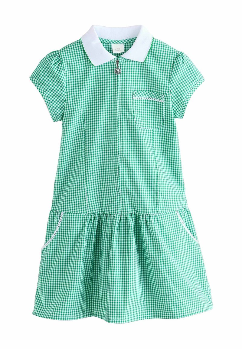 Vihreä ruudullinen mekko, jossa on valkoinen kaulus, lyhyet hihat ja kerätty hame. Sisältää vetoketjusulun ja rintataskun, jossa on pitsiraita.