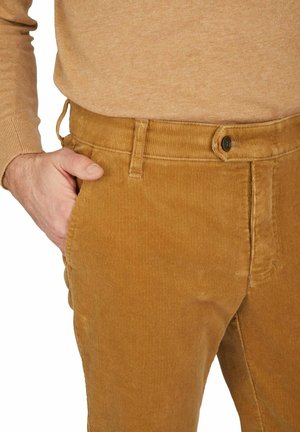 Corduroy pants in a golden-brown color with a textured surface. Features a straight fit, side pockets, and a button closure.