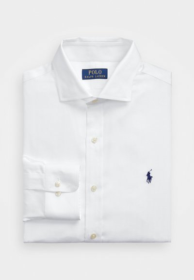 White dress shirt made of cotton with a classic collar. Features a small navy embroidered logo and pearl buttons on the placket and cuffs.
