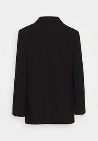 Blazer noir à manches longues avec col, montré de dos sur un fond clair uni.