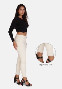 Elara PUSH UP HIGHWAIST - Jeans slim fit - beige