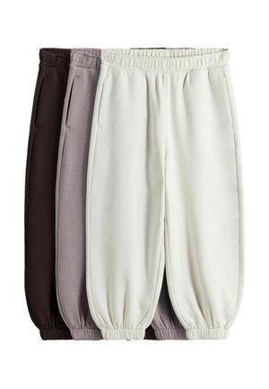 Three pairs of elastic-waist jogger pants in dark brown, light brown, and off-white, stacked side by side on a white background.