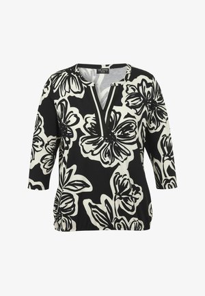 Black and white floral print top with a V-neck, 3/4 sleeves, and gathered waist. Smooth fabric with bold flower patterns.