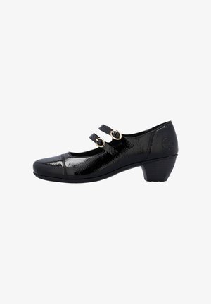 Chaussure Mary Jane en cuir verni noir avec un petit talon épais et deux sangles dorées à boucles sur le côté.