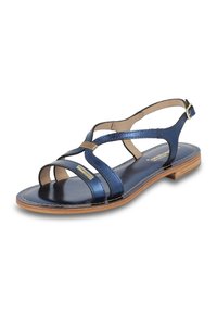 Sandalia de cuero metálico azul con múltiples correas, punta abierta y suela plana de madera. Correa ajustable en el tobillo con acentos en hardware dorado.