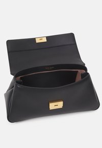 Black leather handbag with a smooth texture, featuring a gold-tone latch closure and a single compartment inside. Subtle brand logo inside.