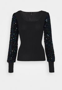 Pull noir côtelé avec des manches longues ornées de sequins. Les manches présentent des sequins colorés de tailles variées, ajoutant texture et intérêt visuel.