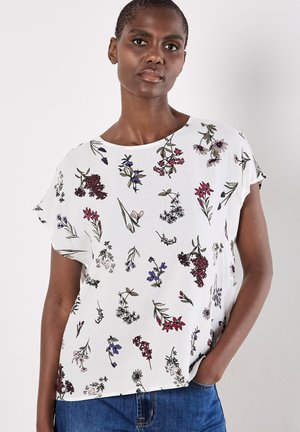 Kurzärmlige, weiße Bluse mit einem floralen Muster in lila, rot und grün. Leicht und entspannender Schnitt mit rundem Ausschnitt.