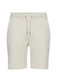Hellbeige Shorts aus weichem Baumwollmaterial. Ausgestattet mit einem elastischen Bund und Kordeln sowie einem schlichten, geraden Schnitt.