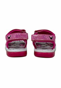 Sandali rosa con cinturini glitterati, chiusura in Velcro e sottopiede imbottito bianco con un motivo. Accenti notevoli di silhouette di topo nera.