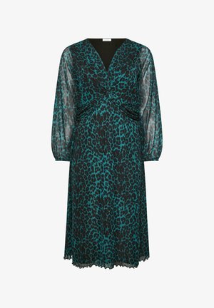 Lyhythihainen, petrooli- ja mustaspotillinen mekko, joka on varustettu V-pääntiellä ja kierretyllä yksityiskohdalla vyötäröllä, sekä ilmavalla, läpikuultavalla kankaalla.