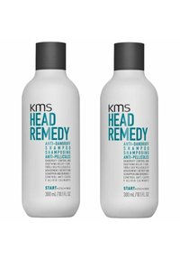 Two white bottles of KMS Head Remedy anti-dandruff shampoo, each 300 mL, with black caps and teal text detailing product information.