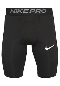 Svarta Nike Pro kompressionsshorts med grå midjebandslogotyp och en vit Nike swoosh på högra låret.