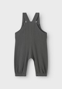 Salopette in cotone grigio scuro con spalline regolabili, orli alla caviglia arricciati e superficie texturizzata. Nessuna tasca o hardware visibile.