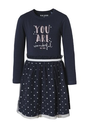 Granatowa sukienka z długim rękawem w srebrne kropki, z napisem "Jesteś Wspaniała" i falbaną na spódnicy z elastycznym paskiem w talii.