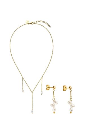 Gold necklace with three small hanging white pearls and matching gold earrings with three clustered white pearls on chains.