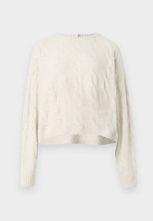 Kerman neule, jossa on pyöreä pääntie, lyhyt helma ja ribbireunat. Materiaalissa on tekstuuri. 