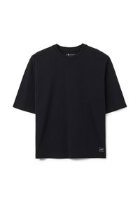 T-shirt nera a maniche corte realizzata in cotone. Presenta un colletto a giro e un piccolo dettaglio con logo sull'orlo inferiore sinistro. Texture liscia.