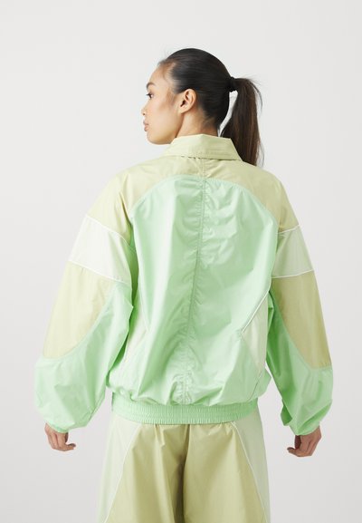 adidas by Stella McCartney TRACKTOP - Training jacket - glow green/halo gold