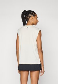 ASICS GAME SEASONAL GRAPHIC TOP - Sports T-shirt - cream