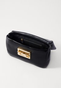 Black leather handbag with a gold rectangular clasp. It features a zippered inner pocket and smooth texture, with a soft, rounded shape.