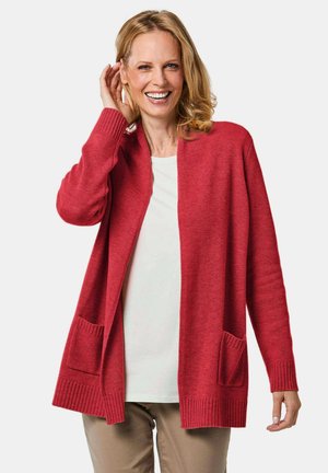 Cardigan rosso lungo in tessuto morbido, con polsini e orlo a coste, design aperto e due tasche frontali.