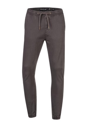 Pantalon jogger slim gris foncé avec taille élastique, cordon, poches latérales et poignets élastiqués aux chevilles.