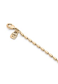 Cadena en tono dorado con eslabones ovalados, un cierre de langosta y un pequeño charm marcado con 'UNO'. Textura suave con un acabado pulido.