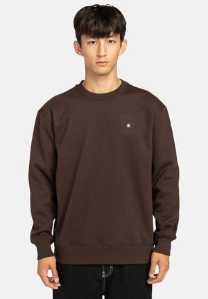 Bruine sweatshirt met een ronde halslijn, geribbelde mouwen en onderrand. Bevat een klein logo-opnaad op de borst. Zacht, textuurstof.