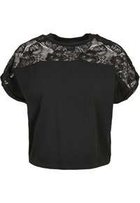 Black t-shirt featuring a textured lace design across the shoulders, with short sleeves and a relaxed fit. Soft cotton material.